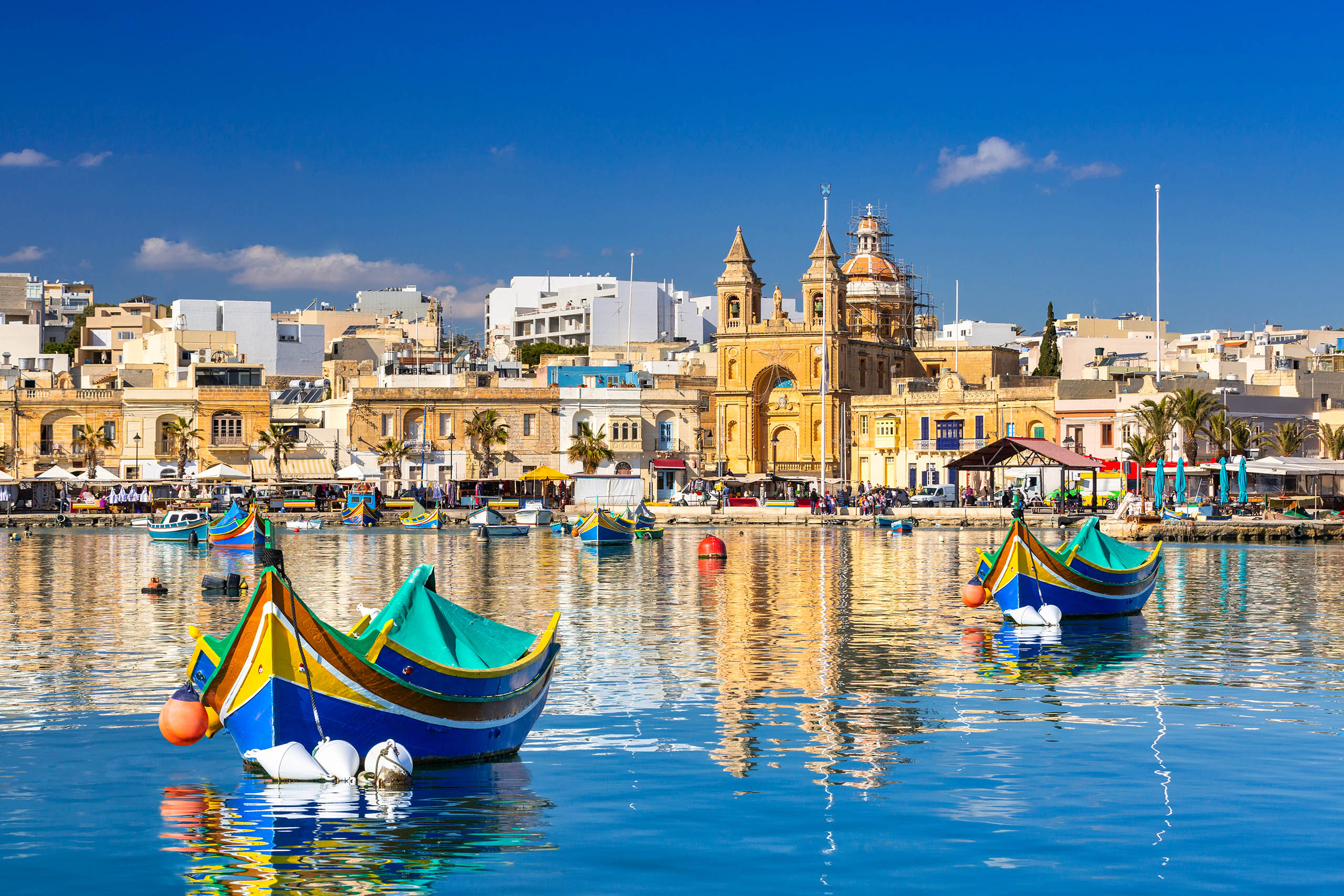 Traditional,Fishing,Boats,In,The,Mediterranean,Village,Of,Marsaxlokk,,Malta